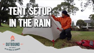 Setting Up A Tent In The Rain