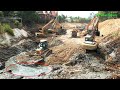 Process bulldozer clearing muddy foundation canal  excavator activities climbing steep slope