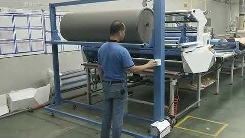 Spreader Machine with Fabric Loader Device