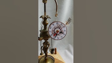 Clock with feather sweep