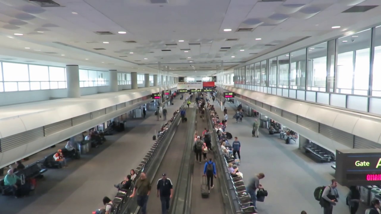 People at airport lobby walking to gate plane | walkalator | flat escalator