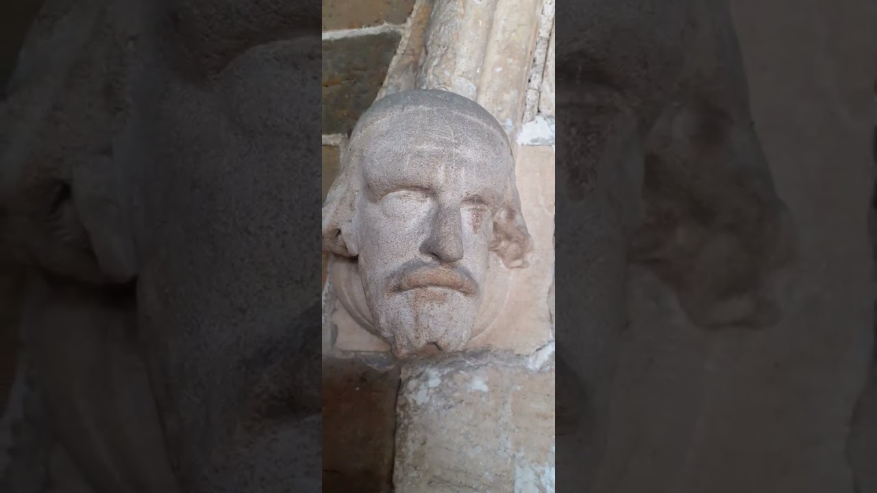 A NICE PAIR !! OF CARVED STONE HEADS ,SAINT WILFRED'S CHURCH ALFORD.