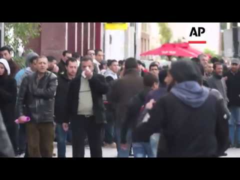 Police clash with demonstrators angered by killing of Belaid