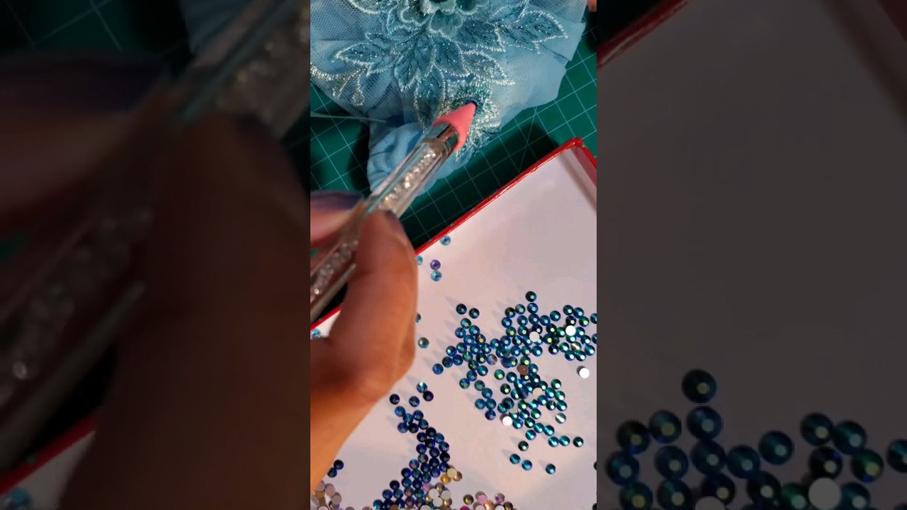 Embellishing my top for Vaporeon with markers and rhinestones 