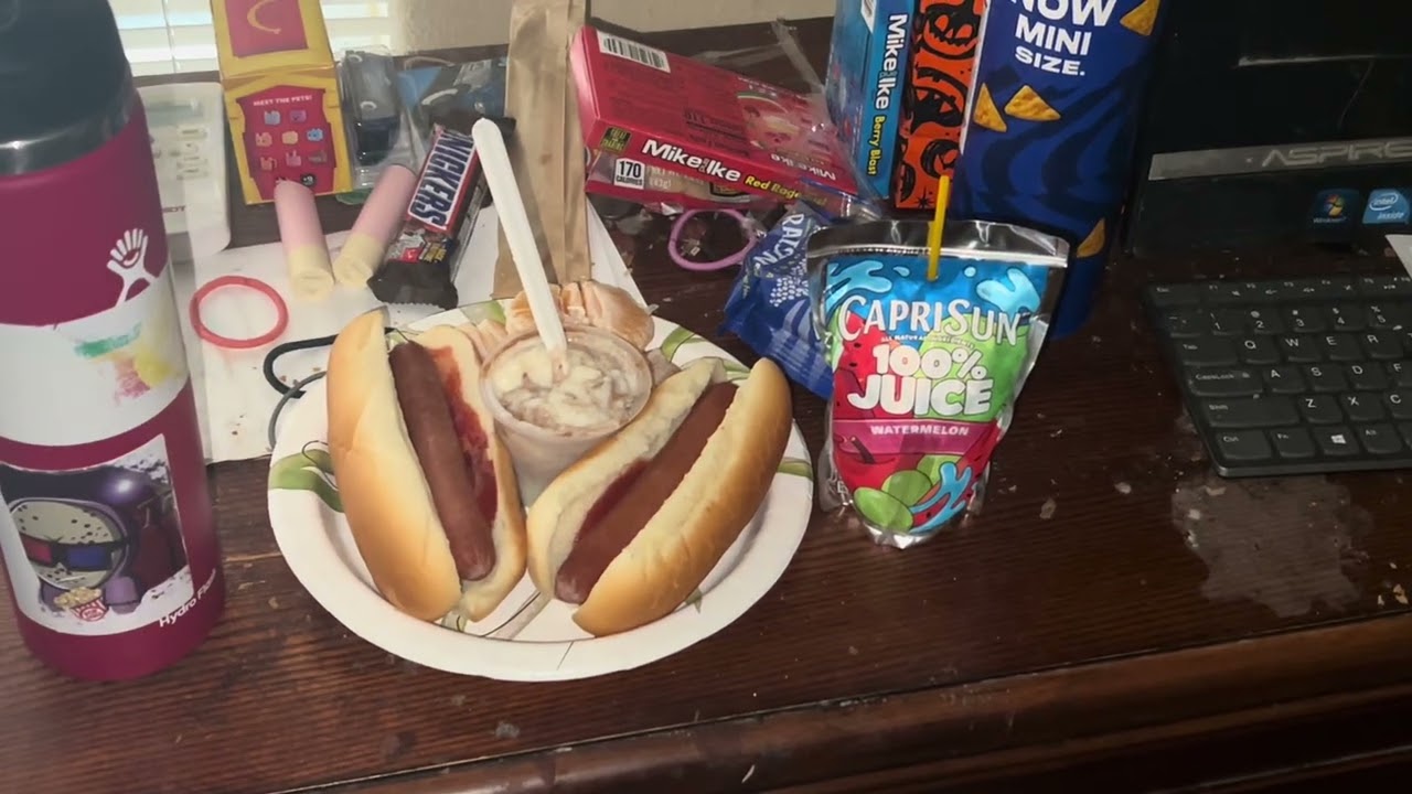 Hot Dogs, Orange Slices, Rice Pudding, and Watermelon Capri Sun Juice