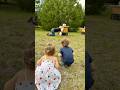 Grandkids watching Pap refilling the bee’s sugar water “Bee Juice”