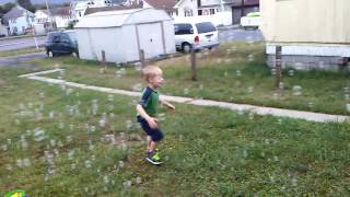 Toby chasing bubbles from his Gazillion Monsoon Bubble Machine n