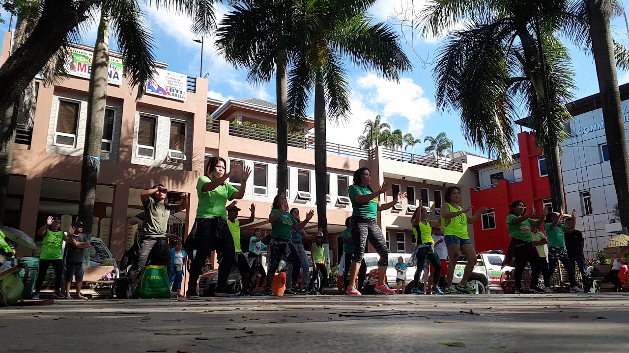 Zumbaranggay in green 12 dancing in the street