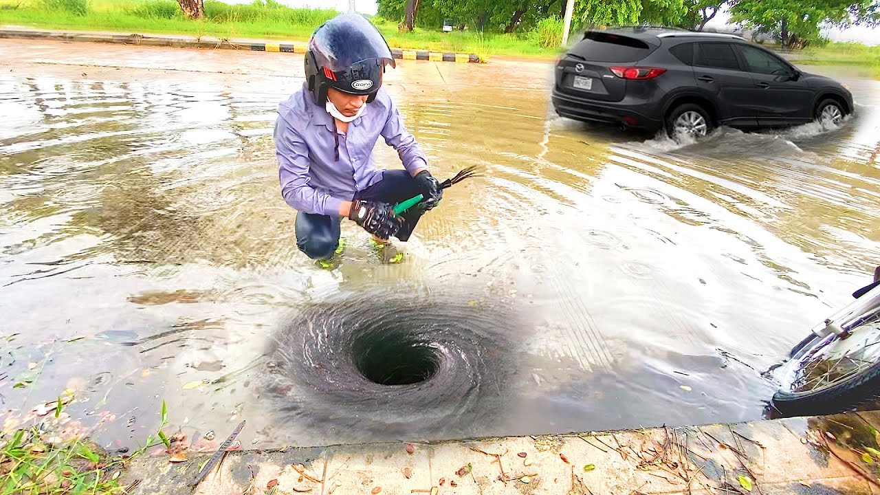 Unclogging Drains for Flooded Roads After A Heavy Rain - YouTube
