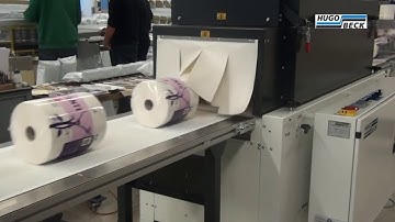 Hugo Beck - Shrink wrapping of tissue rolls in printed film