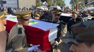 Funeral held for military victims as shelling continues in Syria