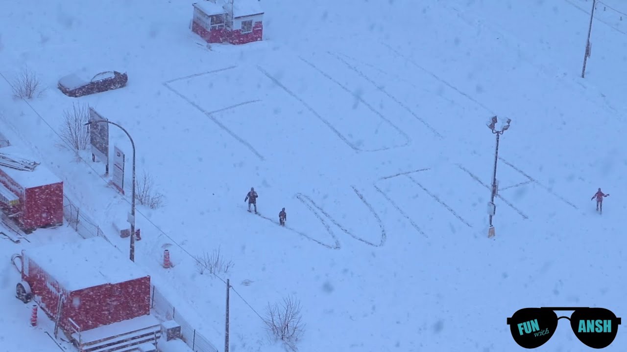 Giant Snow Text Art With Ansh in Montreal's snowy day .
