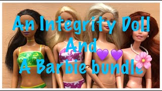 AN INTEGRITY DOLL AND A BOX OF BARBIES - ADULT COLLECTOR