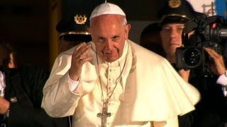 Pope returns from Holy Land visit, vows to fight child abuse