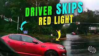 Driver Skips a Red Light as It Rains