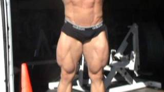 Greg McCoy trains back and poses