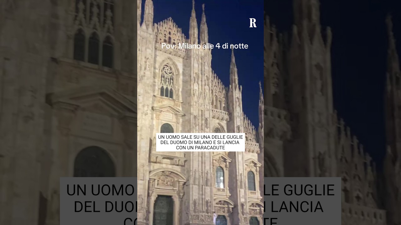 Un uomo sale su una delle guglie del Duomo di Milano e si lancia con un paracadute