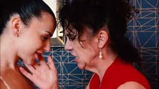 young girl passionately kissing a mature woman