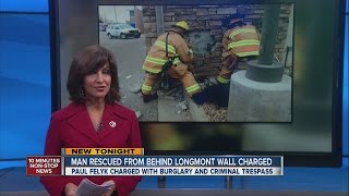 Man rescued from Longmont store's walls arrested