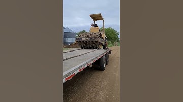 Unloading sheepsfoot soil compactor to prep for another grain bin build.