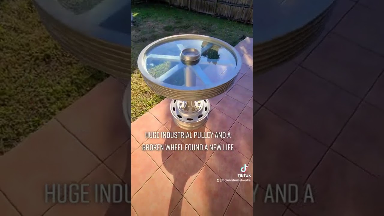 High top table made from industrial pulley & truck wheel 