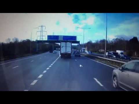 Terrifying moment "brain fart" motorist swerves across motorway and safety markings
