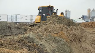Incredible power machine Bulldozer operator dirt pushing Shantui DH17c2