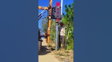 Install galvanized posts for highway guardrail- Good tools and machinery make work easy