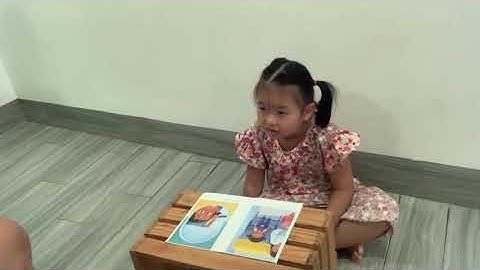 Tiếng Anh Giao Tiếp Thiếu Nhi Tại Phan Thiết: Cherry reading a book On An Airplane