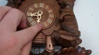 This is a Black Forest Germany 3 Deer Hunter Theme 1 Day Cuckoo Clock With Night Silencer Shut Off Lever. It has a Regula 25 