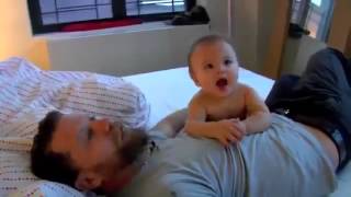 Young father Wrestling with newborn baby