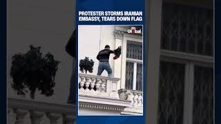 Protester Pulls Down Iranian Flag at London Embassy During Anti-Regime Demonstration