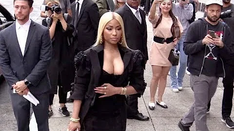 Nicki Minaj and her massive cleavage arrive at the...