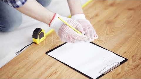 Close Up Of Man Measuring Flooring And Writing 8 | Stock Footage - Envato elements