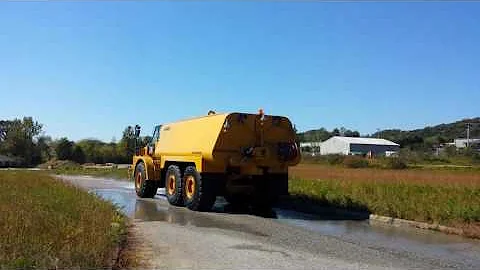 New CAT 745C 9,000 gallon water truck with front spray bar by HEC(5)