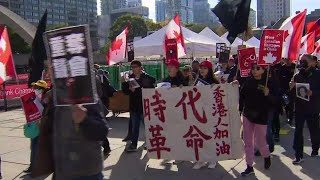 The crowd may not have been large but it was loud as pro-democracy
protesters fiercely chanted they marched down toronto's streets in
solidarity with ...