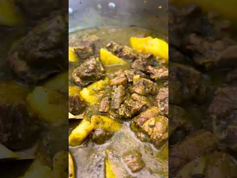 West Indian Curry Goat served with soft & flaky paratha.