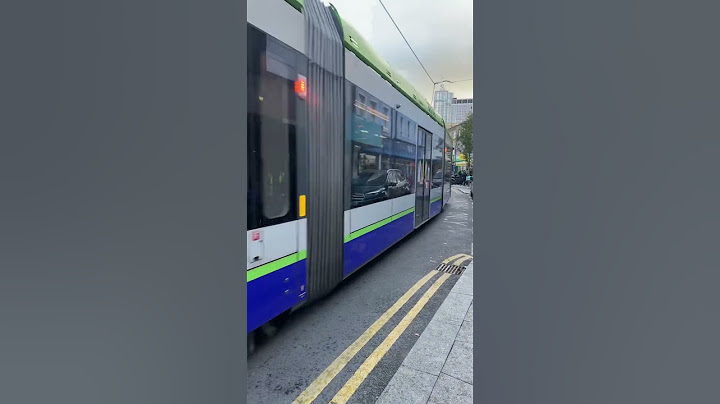 London tram in busy road #london #tram