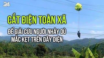 Cắt điện toàn xã để giải cứu người nhảy dù mắc kẹt trên dây diện | VTV24
