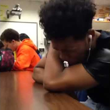 black guy crying over music