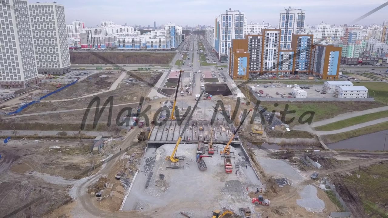 D-Log. Ekaterinburg, Russia. Construction of a bridge over the river. New Construction Area - Akade