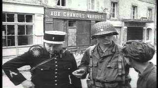 French civilians greet United States troops entering Sainte-Mere-Eglise during Wo...HD Stock Footage