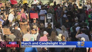 Hundreds call for end to racial injustice during march, candlelight
vigil in glendale