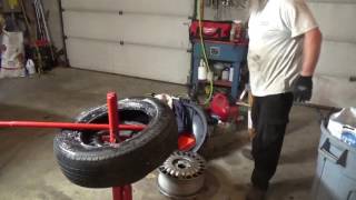 Changing a tire with a manual tire changer- Is it worth it?