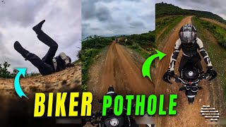 Biker Loses Balance After Hitting Pothole