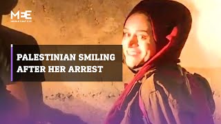 Palestinian woman smiles after being arrested