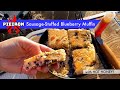 Pieiron sausage-stuffed blueberry muffin with HOT HONEY - a sweet and spicy campfire breakfast combo