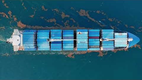 aerial drone footage of large blue container ship  2PRVURR