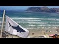 Shark alarm goes off at muizenberg beach south africa shark spotters watching over the surfers