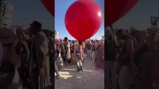 Grooving Girl at Festival With Balloon on Head